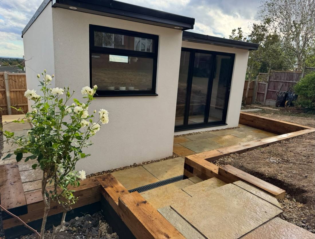 Window and doors behind a white rose